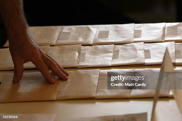 Teacher at Prior Park College adjusts the envelopes containing his pupils GCSE results on August 23 2007 in Bath, England. Pupils in England and...