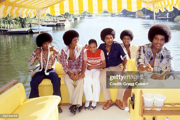 Janet Jackson with her brothers Marlon Jackson, Michael Jackson, Tito Jackson, Randy Jackson and Jackie Jackson of The Jacksons pose during a...