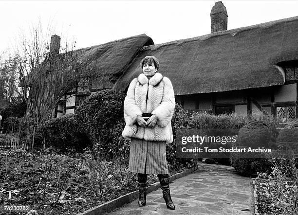Raisa Gorbachev , wife of Russian Politburo member Mikhail Gorbachev outside Anne Hathaway's cottage in Stratford-On-Avon, during an official visit...