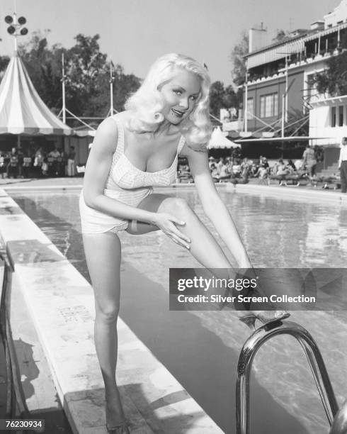 American actress Joi Lansing enjoys a day by the pool, circa 1955.