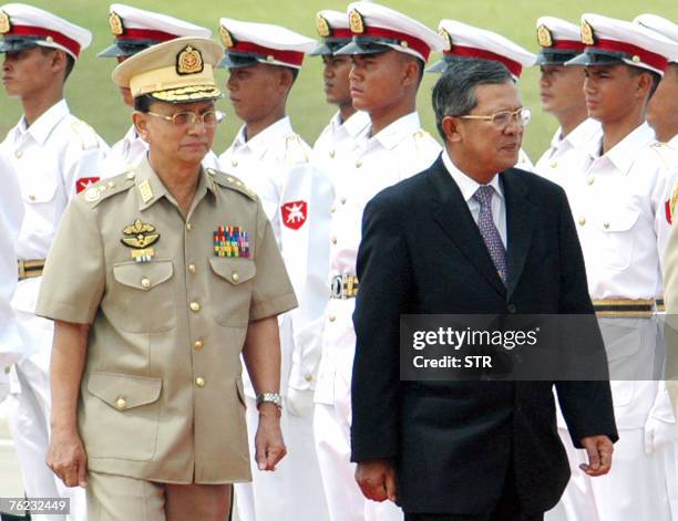 Myanmar's Acting Prime Minister Lt-Gen Thein Sein and Cambodian Prime Minister, Hun Sen review the guard of honour during the welcoming ceremony in...