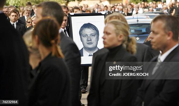 Photo of Joerg Ringel, one of three German police officers killed in an attack in Afghanistan is brought to the graveyard during a funeral ceremony...