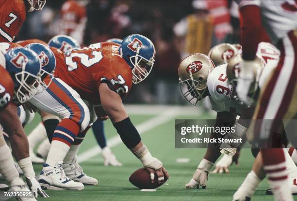 Keith Kartz, Center for the Denver Broncos prepares to snap the ball against Michael Carter, Nose Tackle for the San Francisco 49ers during the...