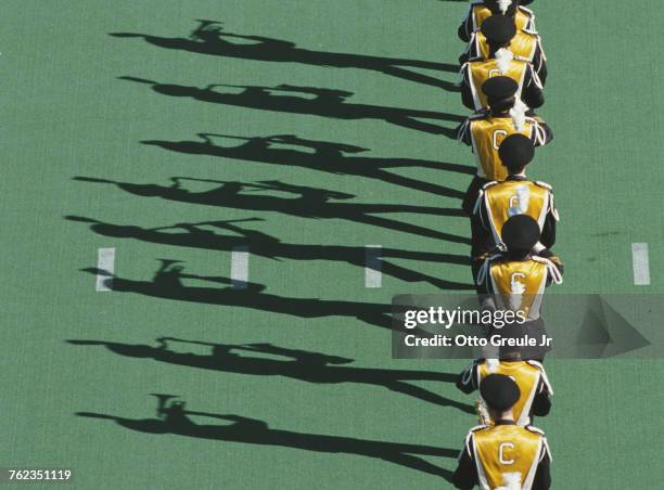 Members of the University of California, Berkeley marching band play to their own shadows before the NCAA Division I-A Pacific-10 Conference game...