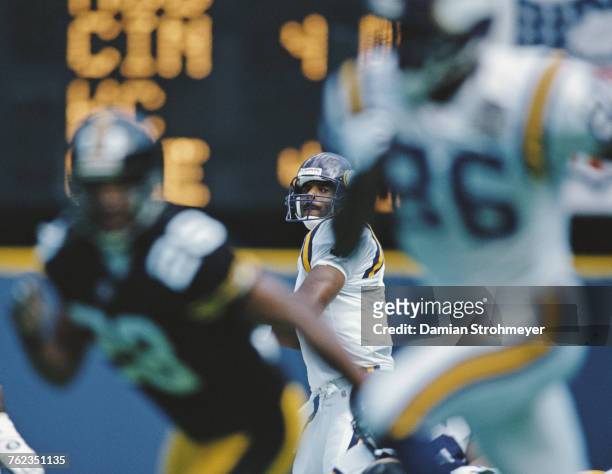 Warren Moon, Quarterback for the Minnesota Vikings prepares to pass to wide receiver Jake Reed during the National Football Conference Central game...