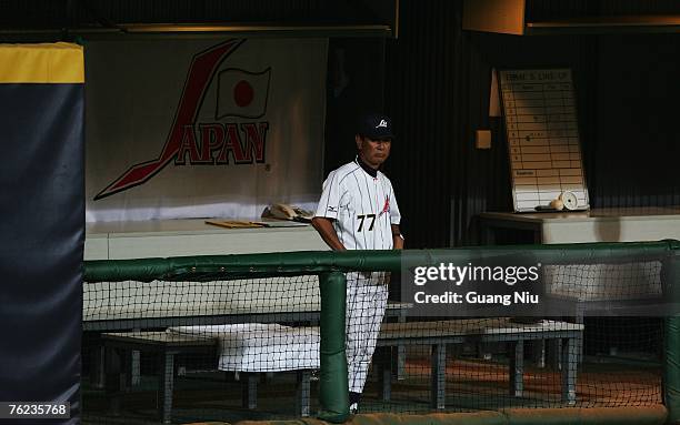 Japanese baseball team manager Senichi Hoshino watches his team play against the China team during the Good Luck Beijing baseball tournament at the...