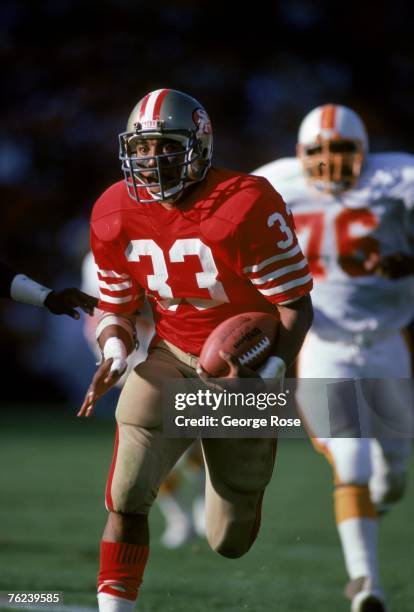 Running back Roger Craig of the San Francisco 49ers breaks away from the Tampa Bay Buccaneers defense during a game at Candlestick Park on November...