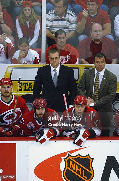 Head coach Paul Maurice, Rod Brind'Amour and Martin Gelinas of the Carolina Hurricanes can only watch after Brendan Shanahan of the Detroit Red Wings...