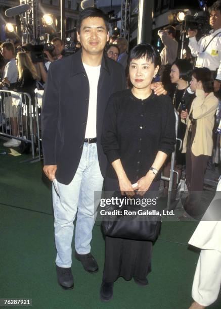 Actor Chow Yun Fat and wife Jasmine Chow attend the "Godzilla" New York City Premiere on May 18, 1998 at Madison Square Garden in New York City, New...
