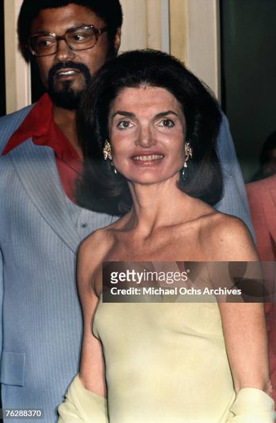 Former First Lady Jacqueline Kennedy attends a campaign event for her brother-in-law, Robert F. Kennedy, alongside his bodyguard, former NFL player...