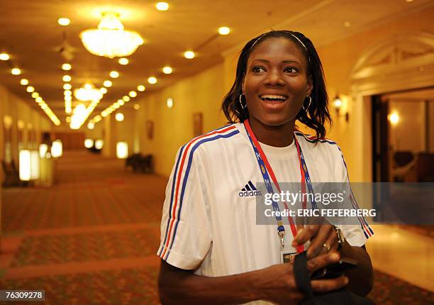 France's sprinter Muriel Hurtis, 24 August 2007, speaks to the press in a hotel a day before the start of 11th IAAF World Championships in Osaka. The...