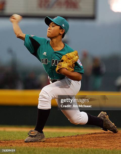 Kai-Ying Chen of the Asia-Pacific team from Taichung, Chinese Taipei pitches against the Japanese team from Tokyo, Japan during the international...