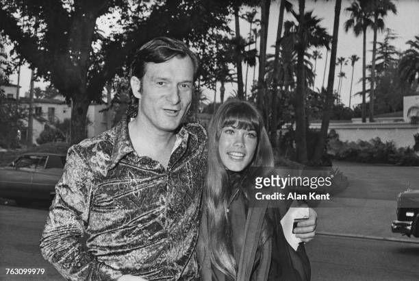 Playboy impresario Hugh Hefner with his girlfriend, Barbi Benton, arriving at a house party given by Polly Bergen and Freddie Fields, Los Angeles,...