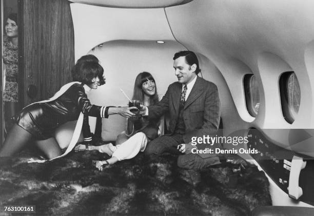 Playboy impresario Hugh Hefner and his girlfriend, Barbi Benton on board Hefner's private DC-9 airliner, 'The Big Bunny', at London Airport , 29th...