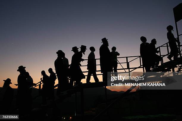 Ultra Orthodox Jews walk to pray at the tomb of Rabbi Isaac Luria Ben-Shelomo at the ancient cemetery of the northern Israeli city of Safed, a city...