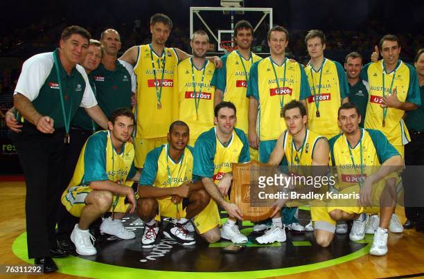 Sam Mickinnon of the Boomers holds the AI Ramsay Shield as he celebrates with team mates after game three of the 2007 FIBA Oceania Men's Championship...