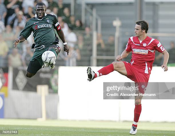 Markus Feulner of Mainz competes with Soumaila Coulibaly of Gladbach during the Second Bundesliga match between FSV Mainz 05 and Borussia...