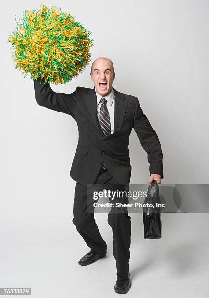 business man waving pompom, portrait - cheerleader white background stock pictures, royalty-free photos & images