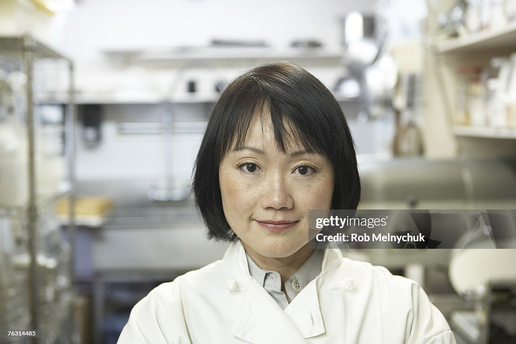Woman in restaurant kitchen, portrait