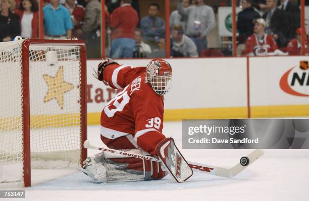 Dominik Hasek of the Detroit Red Wings makes a save shot by the Carolina Hurricanes during game 4 of the NHL Stanley Cup Finals on June 10, 2002 at...