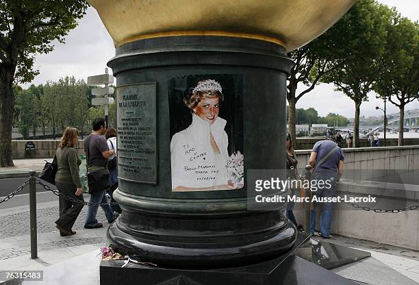 The Place de l'Alma, with its reproduction of New York's Statue of Liberty flame in Paris August 22 has become an unofficial memorial for the tragic...