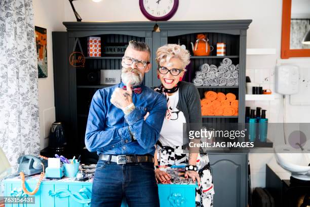 couple in vintage clothes in quirky hair salon - retro hair salon stock pictures, royalty-free photos & images
