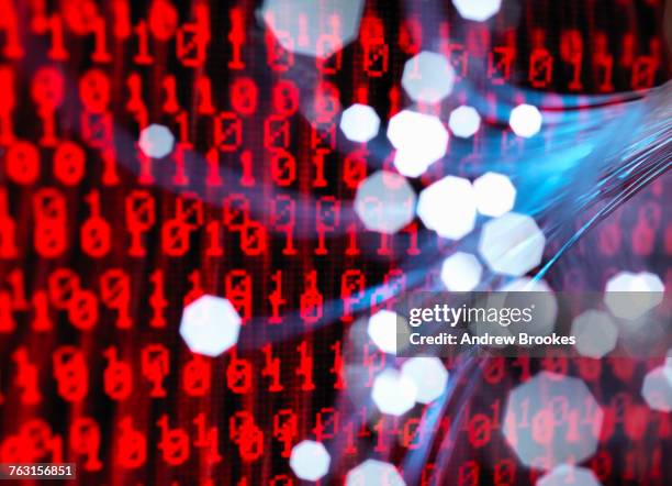 fibre optics carrying data attacking a laptop computer which has a virus - threat intelligence stock pictures, royalty-free photos & images