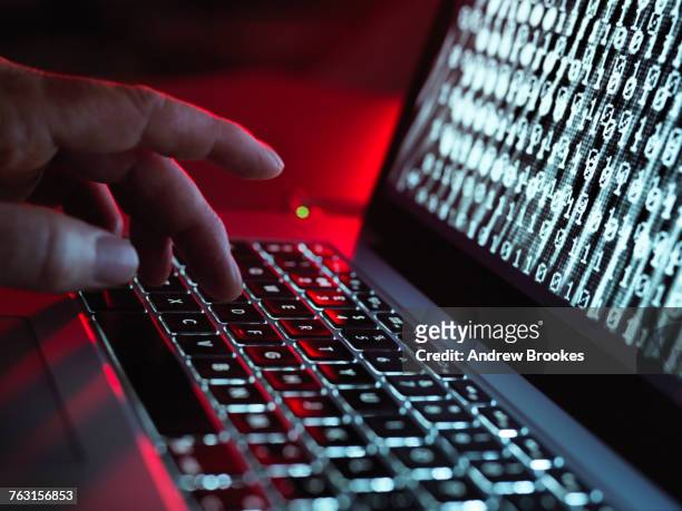 laptop computer being infected by a virus - crime informático imagens e fotografias de stock