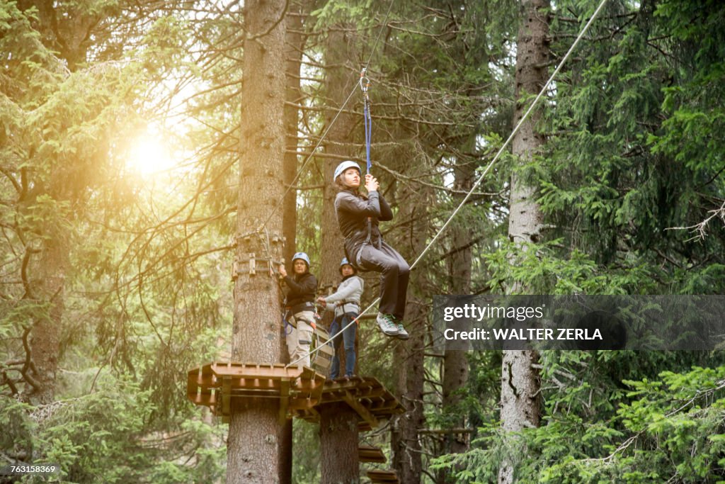 Teenage girl on zip wire