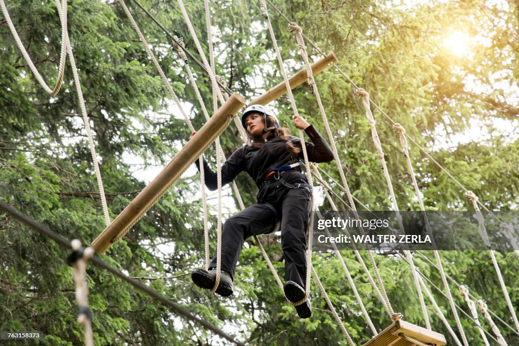 Teenage girl on high rope course