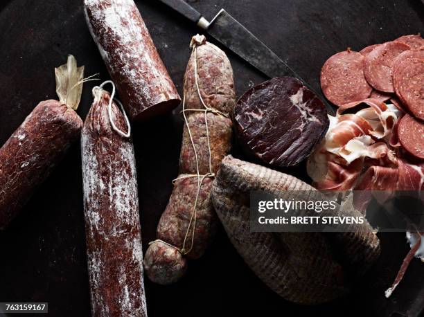 selection of cured meats, overhead view - smoked stock pictures, royalty-free photos & images