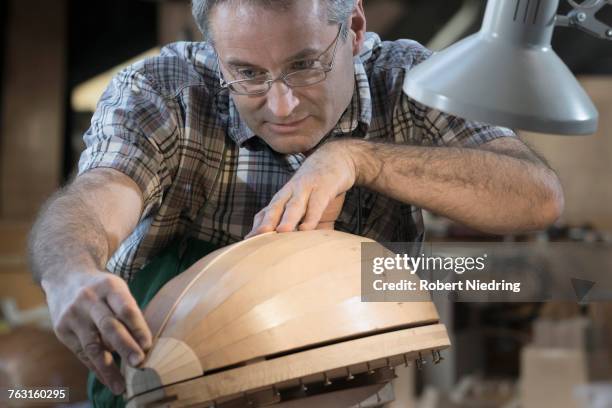 craftsman manufacturing lute at workshop - arabic lutes stock pictures, royalty-free photos & images