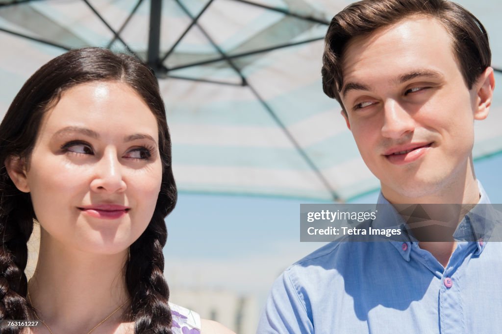 New York, Brooklyn, Couple peeking at each other