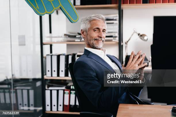 finger pointing on confident mature businessman in office - vanity stock pictures, royalty-free photos & images