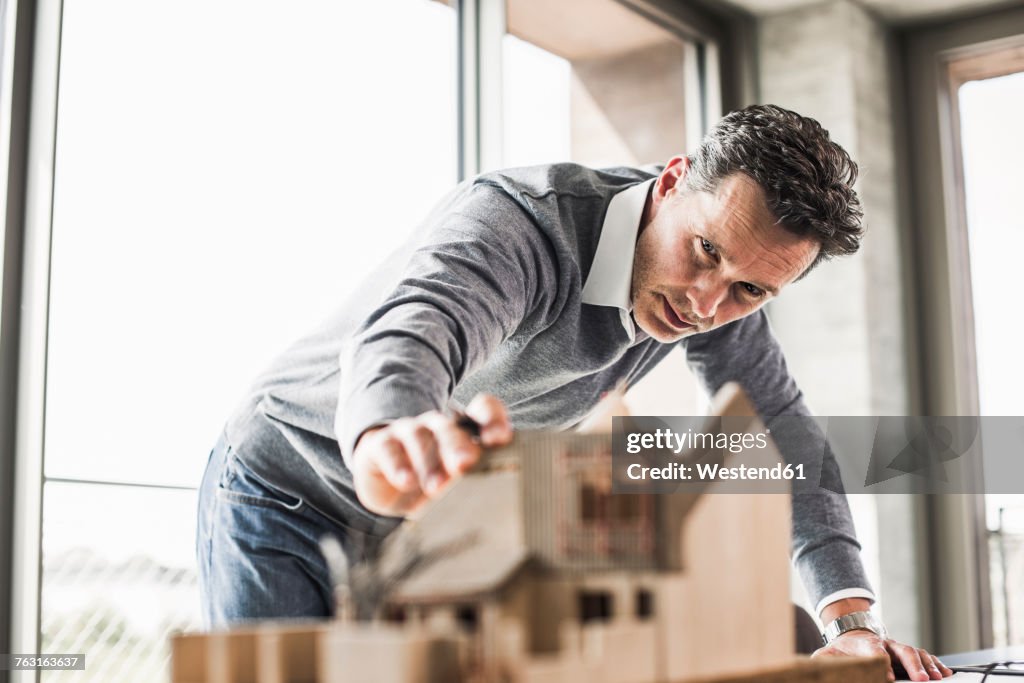 Architect working on architectural model