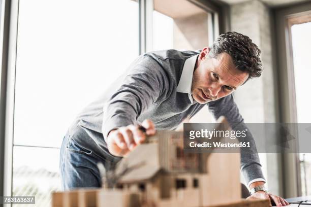 architect working on architectural model - architect stock pictures, royalty-free photos & images