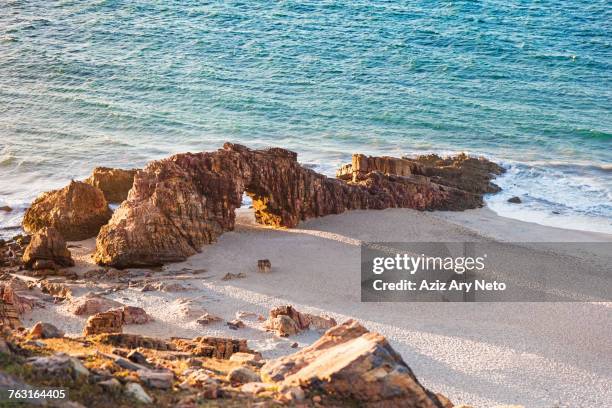elevated view of rock formation on beach, jericoacoara national park, ceara, brazil, south america - jericoacoara stock pictures, royalty-free photos & images