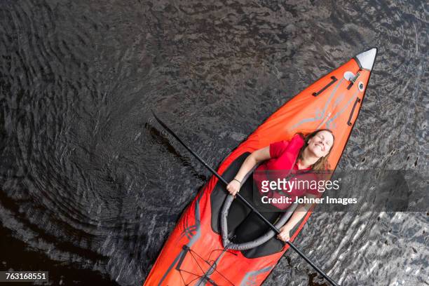 woman relaxing on kayak - västra götaland county stock-fotos und bilder