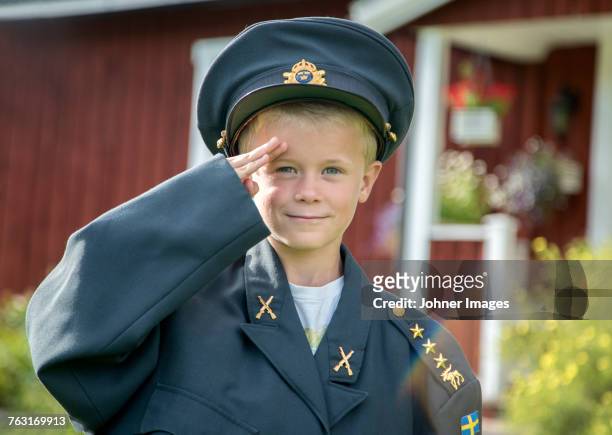 boy in uniform saluting - child saluting stock pictures, royalty-free photos & images