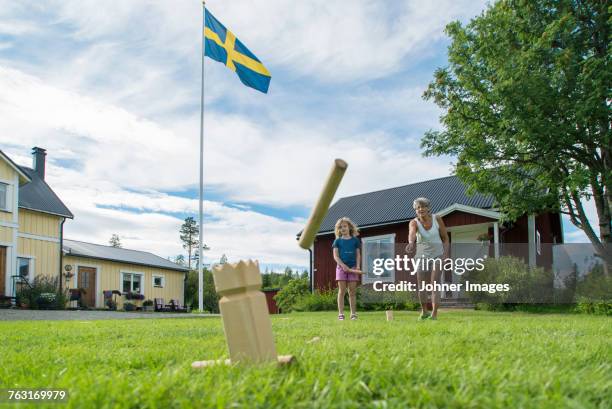 grandmother and granddaughter playing together - swedish flag ストックフォトと画像