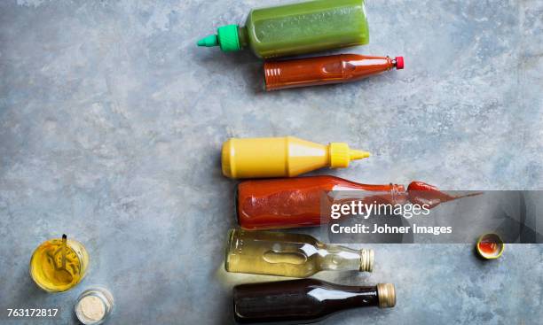 condiments in bottles - condiment stock pictures, royalty-free photos & images