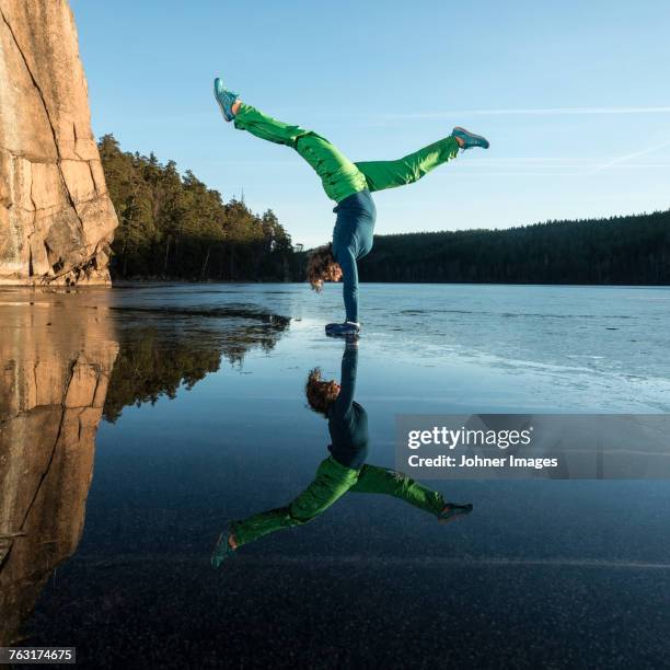 woman doing yoga on frozen lake - sverige vinter bildbanksfoton och bilder