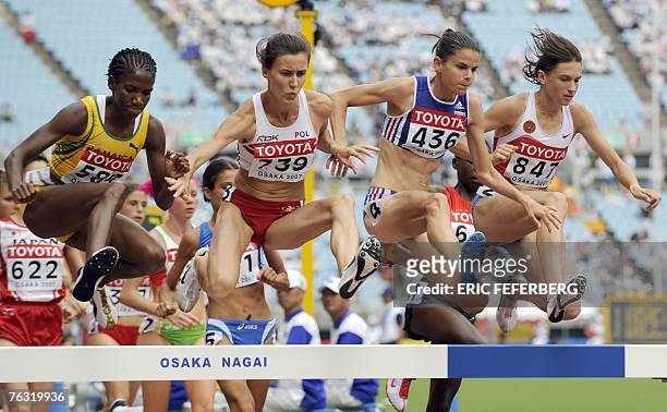 Jamaica's Mardrea Hyman, Poland's Katarzyna Kowalska, France's Sophie Duarte and Russia's Yekaterina Volkova compete during the women?s 3000m...