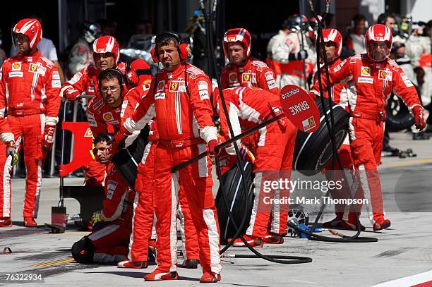 The Ferrari pit crew in action during Qualifying for the F1 Grand Prix of Turkey at Istanbul Park on August 25 in Istanbul, Turkey.