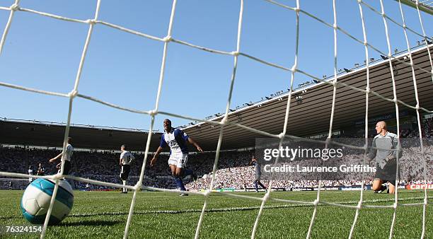 Cameron Jerome of Birmingham celebrates scoring his second goal in front of Stephen Bywater of Derby during the Barclays Premier League match between...