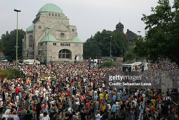 Million people attend the first Loveparade in the rhine area. Ravers dance in front of the synagogue of Essen.