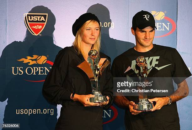 Maria Sharapova of Russia and Roger Federer of Switzerland pose together with their 2007 US Open Series Trophy during a press conference at the USTA...