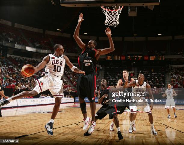 Kobe Bryant of the USA Men's Senior National Team passes against Samuel Dalembert of Canada during the first round of the 2007 FIBA Americas...