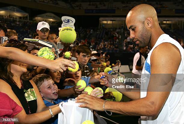 James Blake of the USA signs autographs after the Pilot Pen Tennis Tournament Singles Championship match at the Connecticut Tennis Center at Yale...
