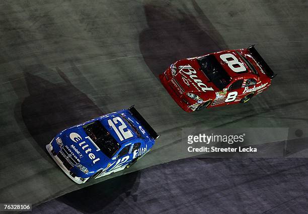 Ryan Newman, driver of the alltel Dodge, leads Dale Earnhardt Jr., driver of the Budweiser Chevrolet, during the NASCAR Nextel Cup Series Sharpie 500...